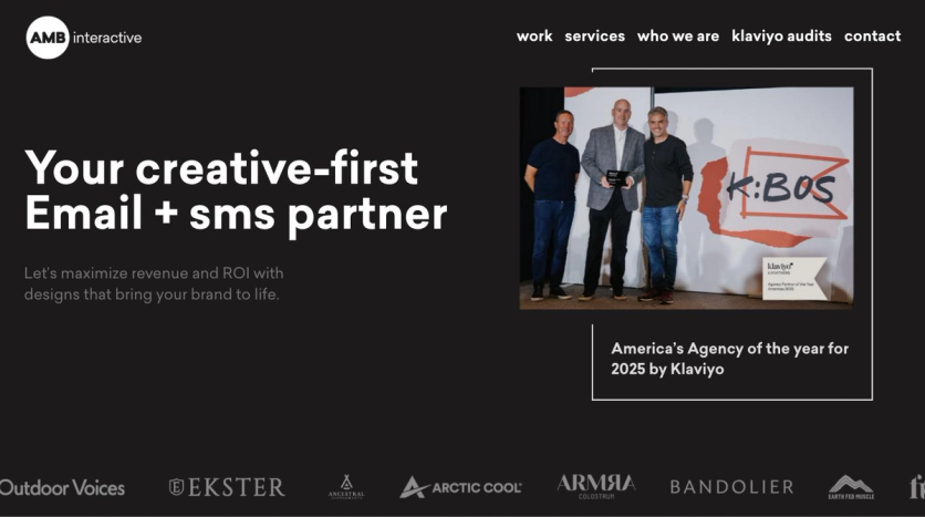 AMB Interactive homepage hero with the headline Your creative-first Email + sms partner, a photo from Klaviyo’s 2025 partner awards, and client logos