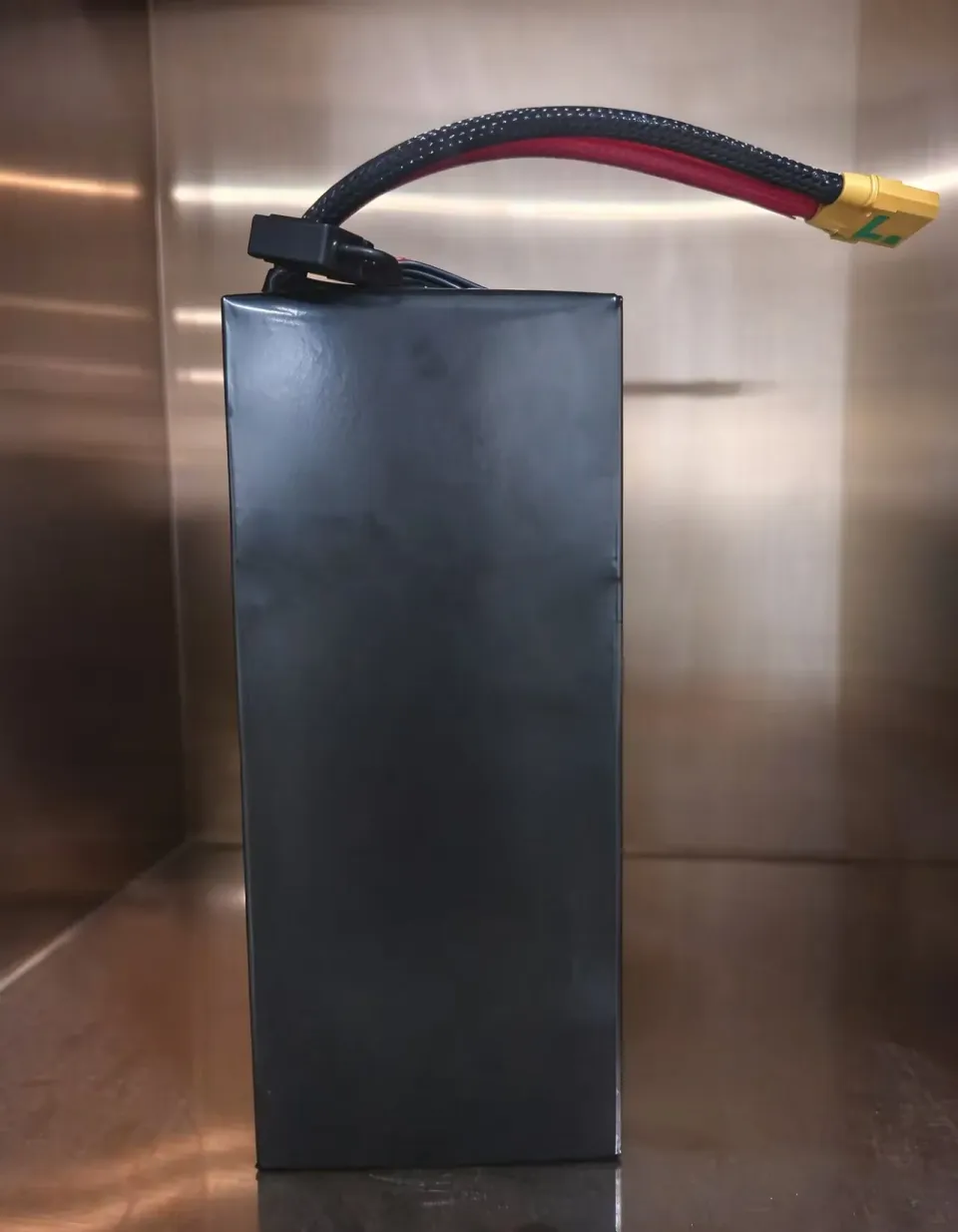 400 Wh/kg 6S UAV reference battery pack with black wrapping and power connector