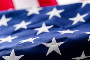 Close up of American flag with the stars in the foreground