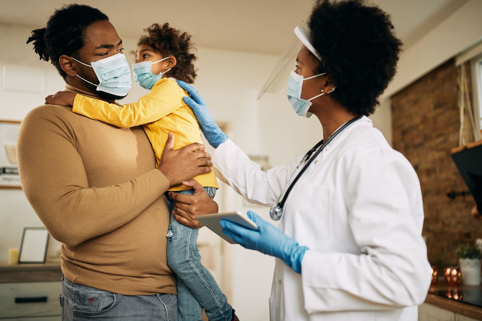 Doctor with father and child