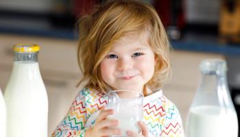 little girl who likes cow's milk | Image credit: Irina Schmidt - stock.adobe.com