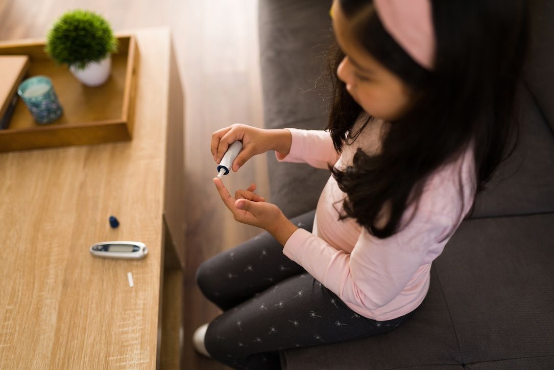 Little girl testing her glucose | Image Credit: AntonioDiaz - stock.adobe.com