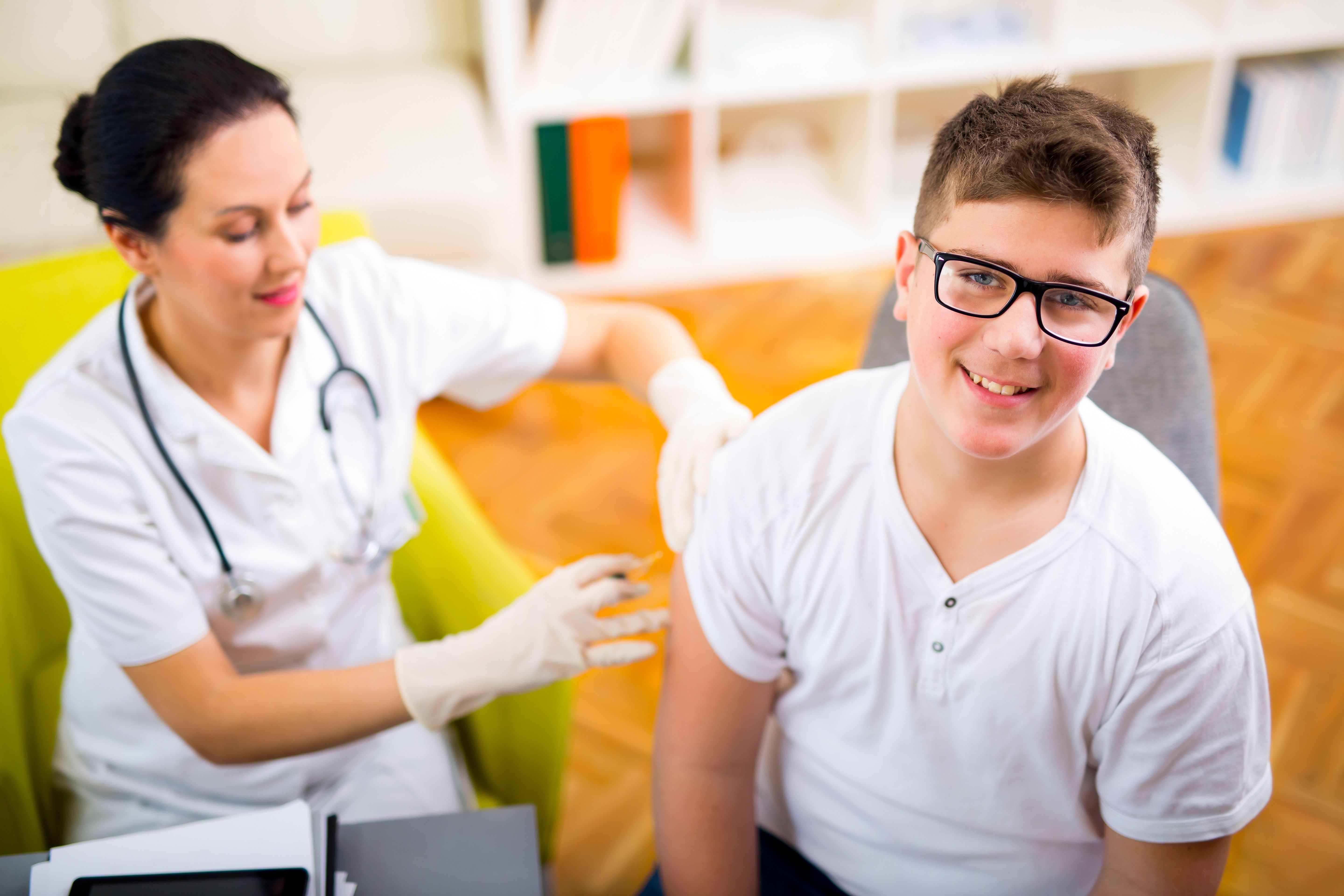 nurse injecting child patient with medicine