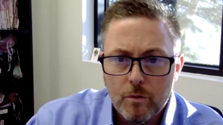 Screenshot of an interview with Shaun McKenzie, MD