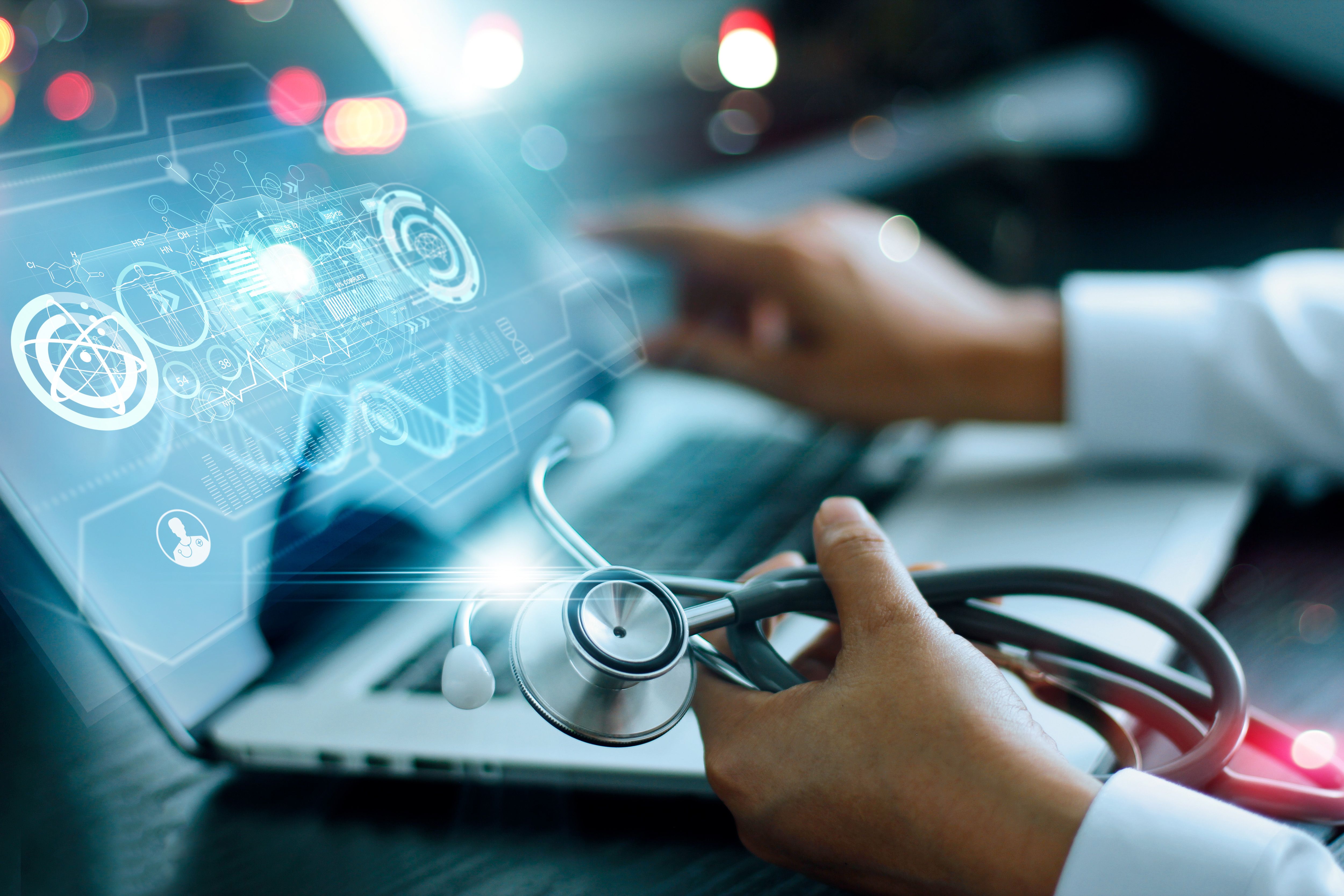 Medicine doctor analysis and diagnosis checking health of patient online and testing result with modern virtual interface on laptop with stethoscope in hand, Online Medical global network - ipopba - stock.adobe.com