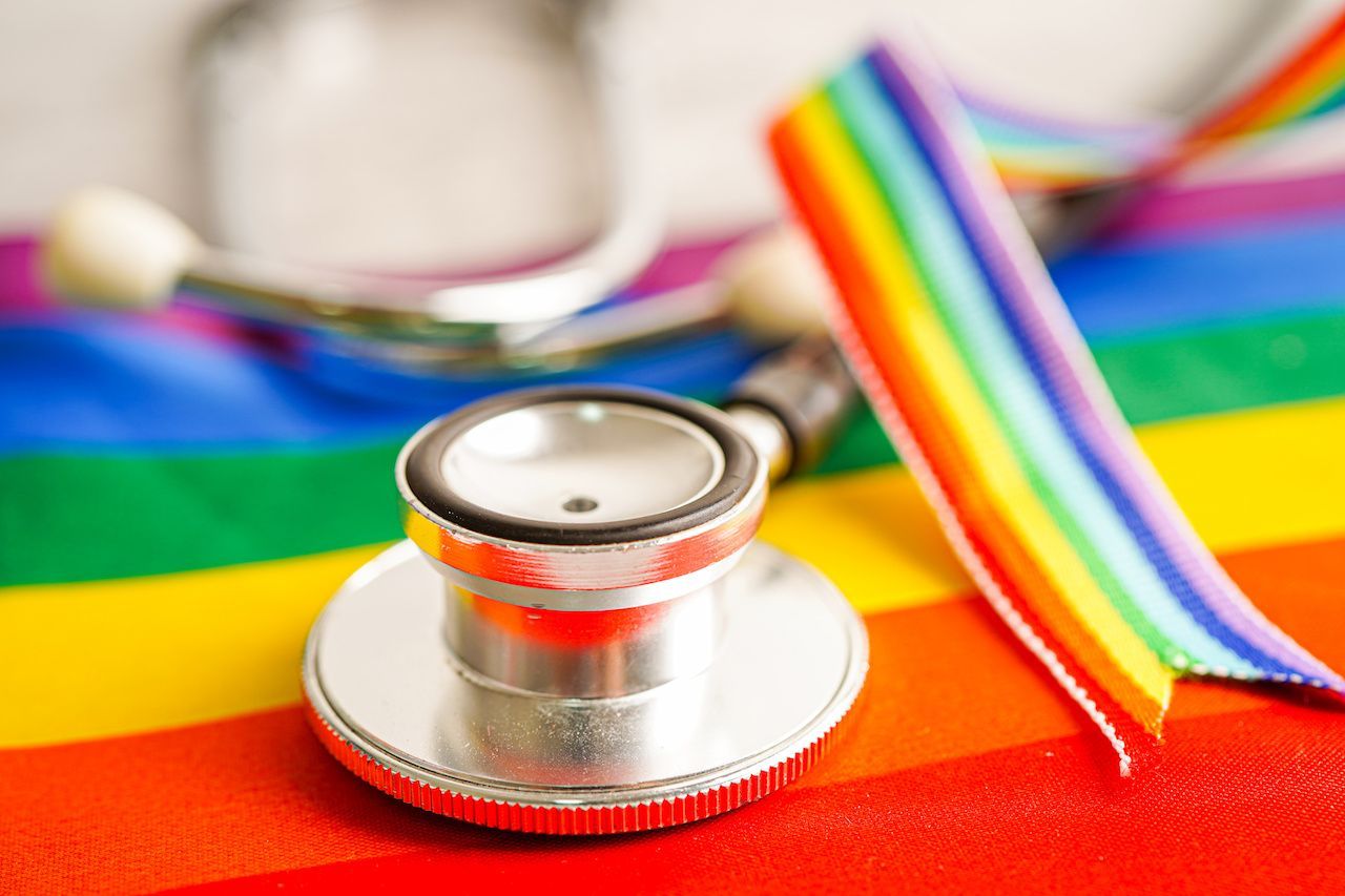 Stethoscope on pride flag | Image Credit: manassanant - stock.adobe.com