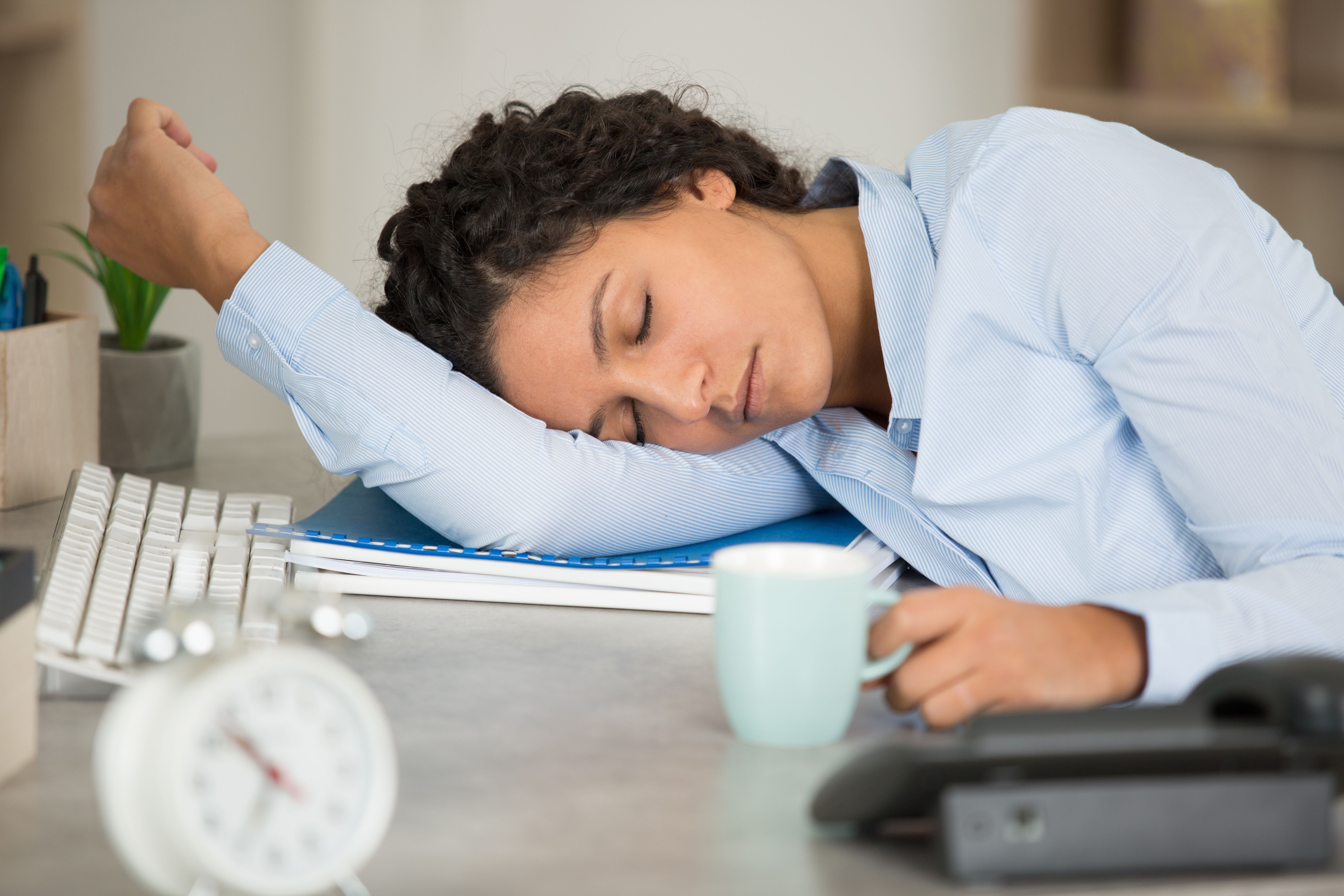 Woman asleep at desk | Image credit: auremar - stock.adobe.com