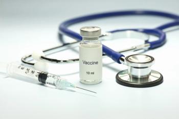 vaccine vial, syringe, and stethoscope