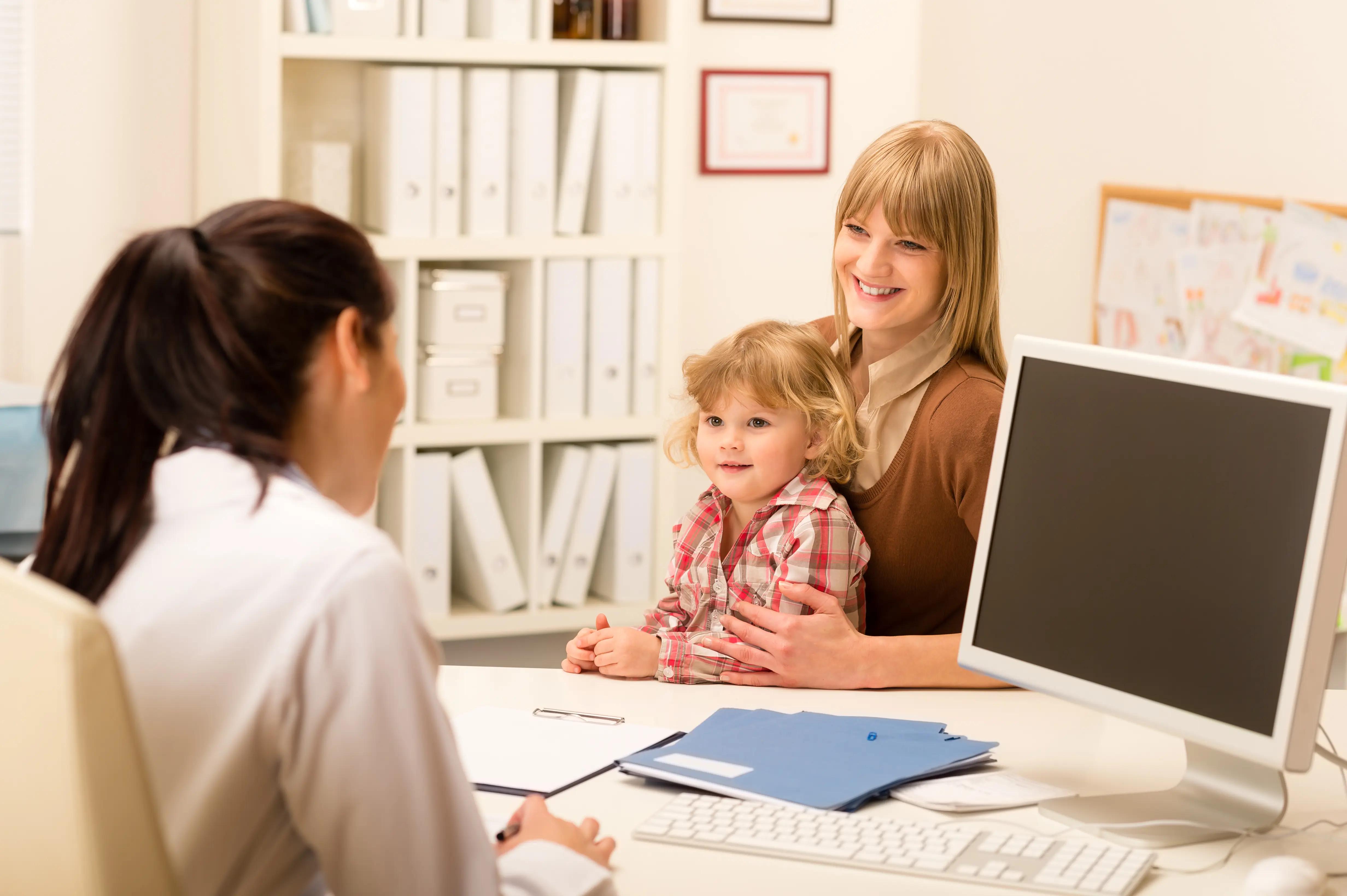 Mom and child speaking to doctor