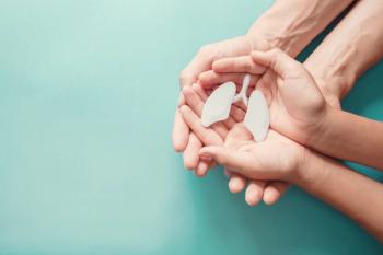 hands cradling model of lungs | Image Credit: SewcreamStudio - stock.adobe.com