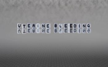 uterine bleeding word or concept represented by black and white letter cubes on a grey horizon background stretching to infinity: © lexiconimages - stock.adobe.com