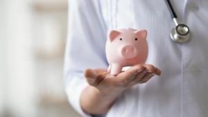 Person holding a piggy bank. | Image credit: @fizkes_AdobeStock.jpeg