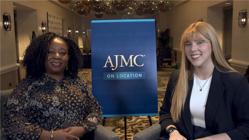 Hayden Klein interviews Nadine Barrett, PhD, with an AJMC On Location sign between them