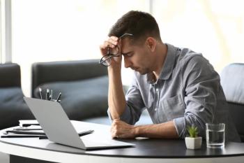 Depressed young business man in office | Image Credit: pixel-shot - adobe.stock.com.jpeg