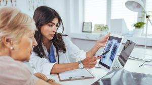 X-ray scan with patient. | Image Credit: DraganaGordic_AdobeStock.jpeg