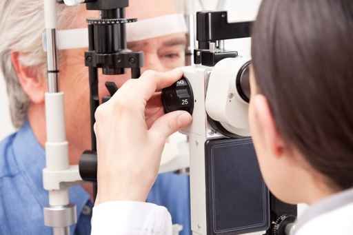 doctor conducting eye exam on patient