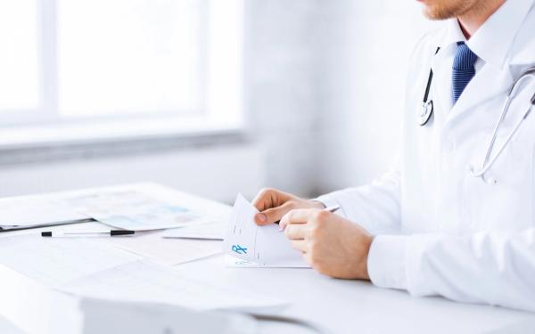 Doctor writing a prescription | Image credit: Syda Productions - stock.adobe.com