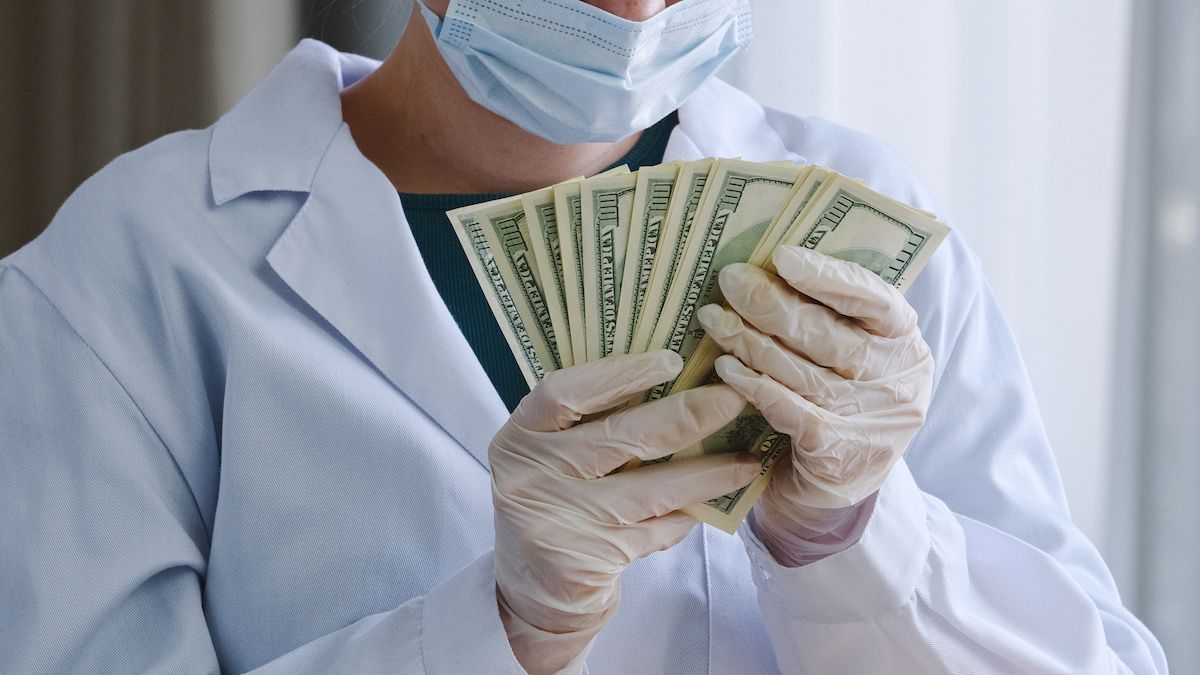 doctor accepting money for prescribing MS medicines | Image credit: Yuliia - stock.adobe.com