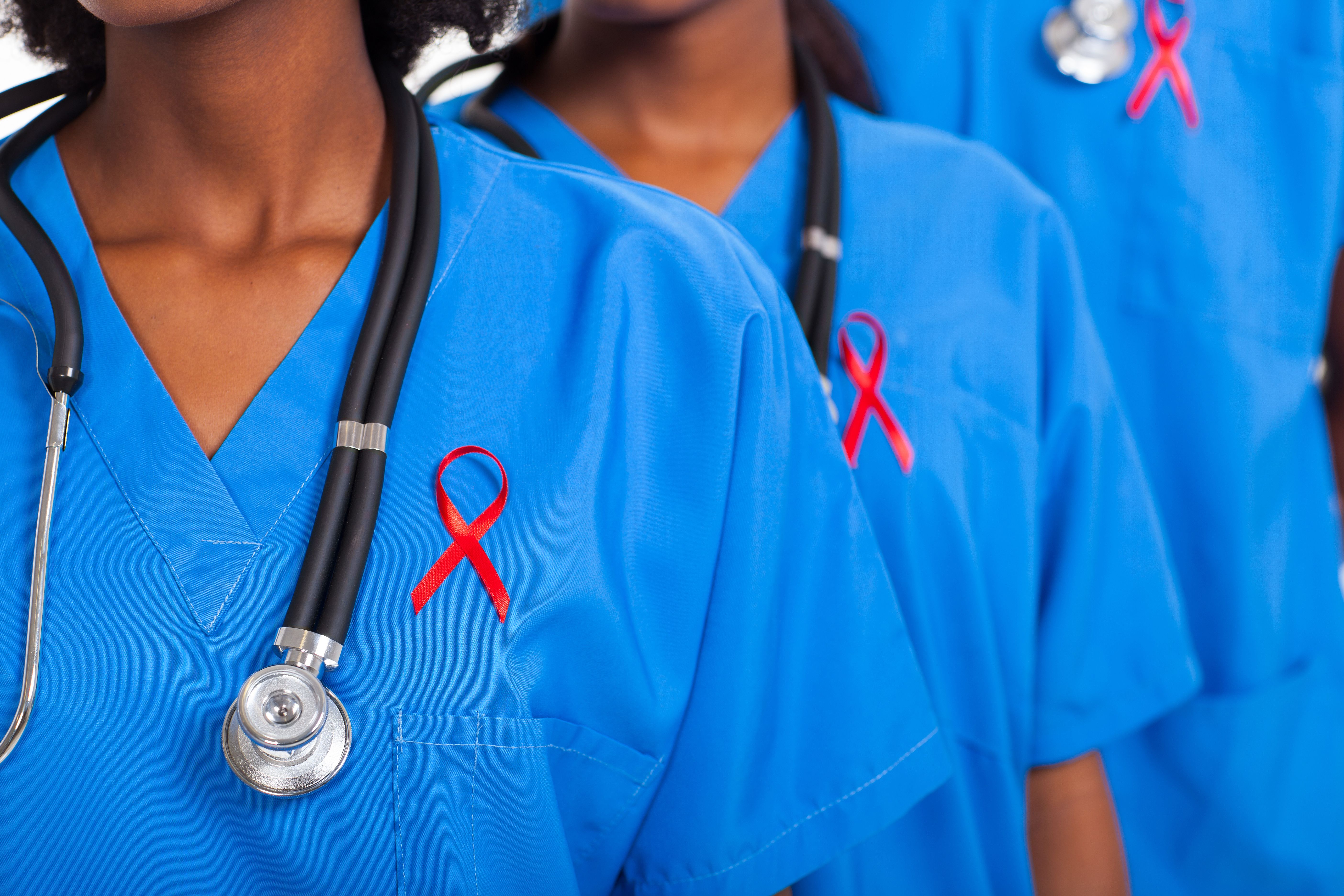 Doctors with red ribbon | Image credit: michaeljung - stock.adobe.com