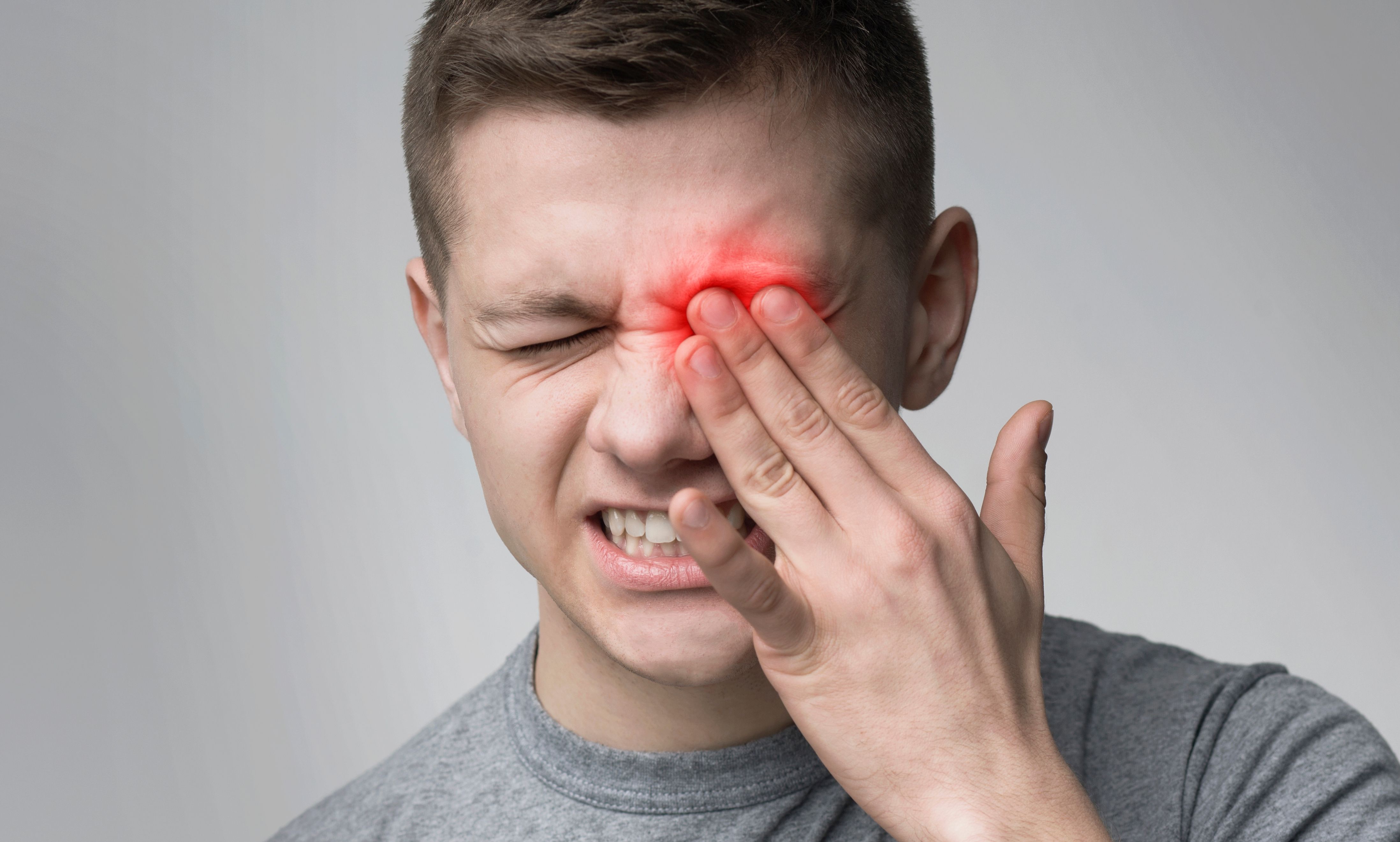 Man affected by eye pain | Image credit: Prostock-studio - stock.adobe.com