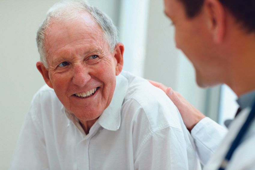 old man talking to a doctor