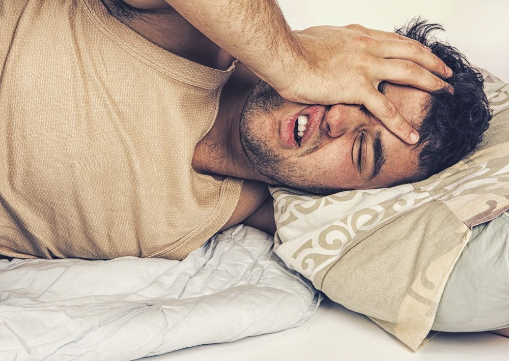 Image of man unable to sleep