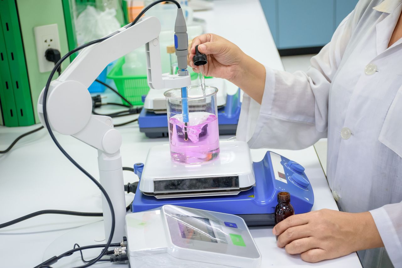 Image of scientist testing treatments in the lab