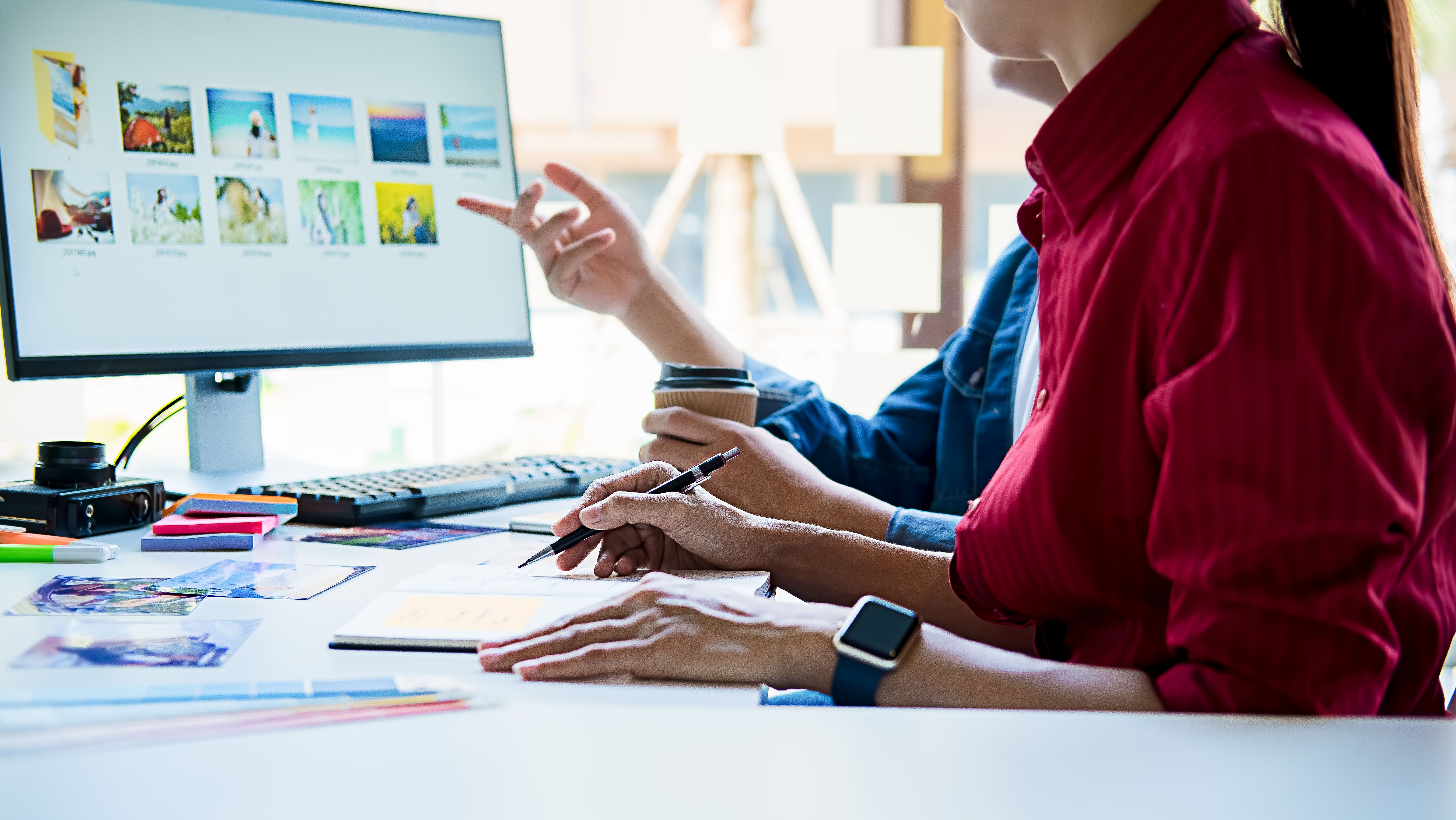 Two people working at a computer