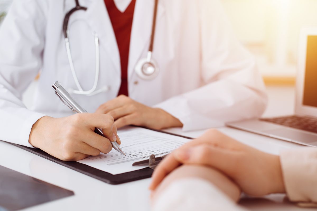 Physician speaking with patient.