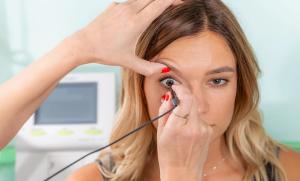A skilled ophthalmologist conducts a thorough ocular examination to assess eye health in a clinical setting | Image Credit: Microgen - stock.adobe.com