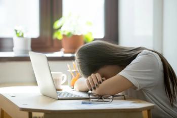 Woman asleep at desk | Image credit: fizkes - stock.adobe.com
