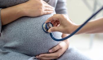 pregnant woman visiting the doctor | Image credit: Pituk - stock.adobe.com