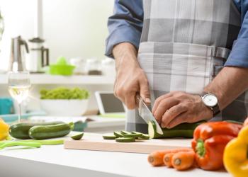 Man cutting cucumbers