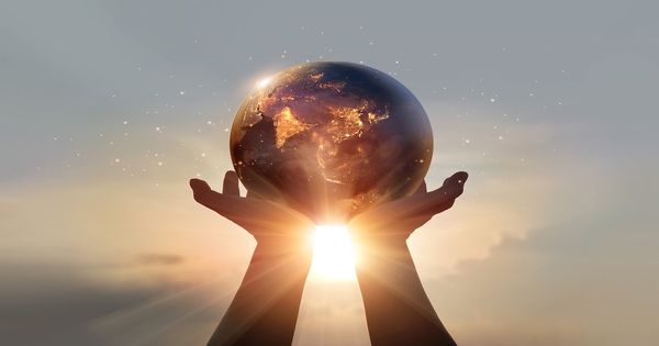 Human holding Earth | Image Credit: ©ipopba-stock.adobe.com