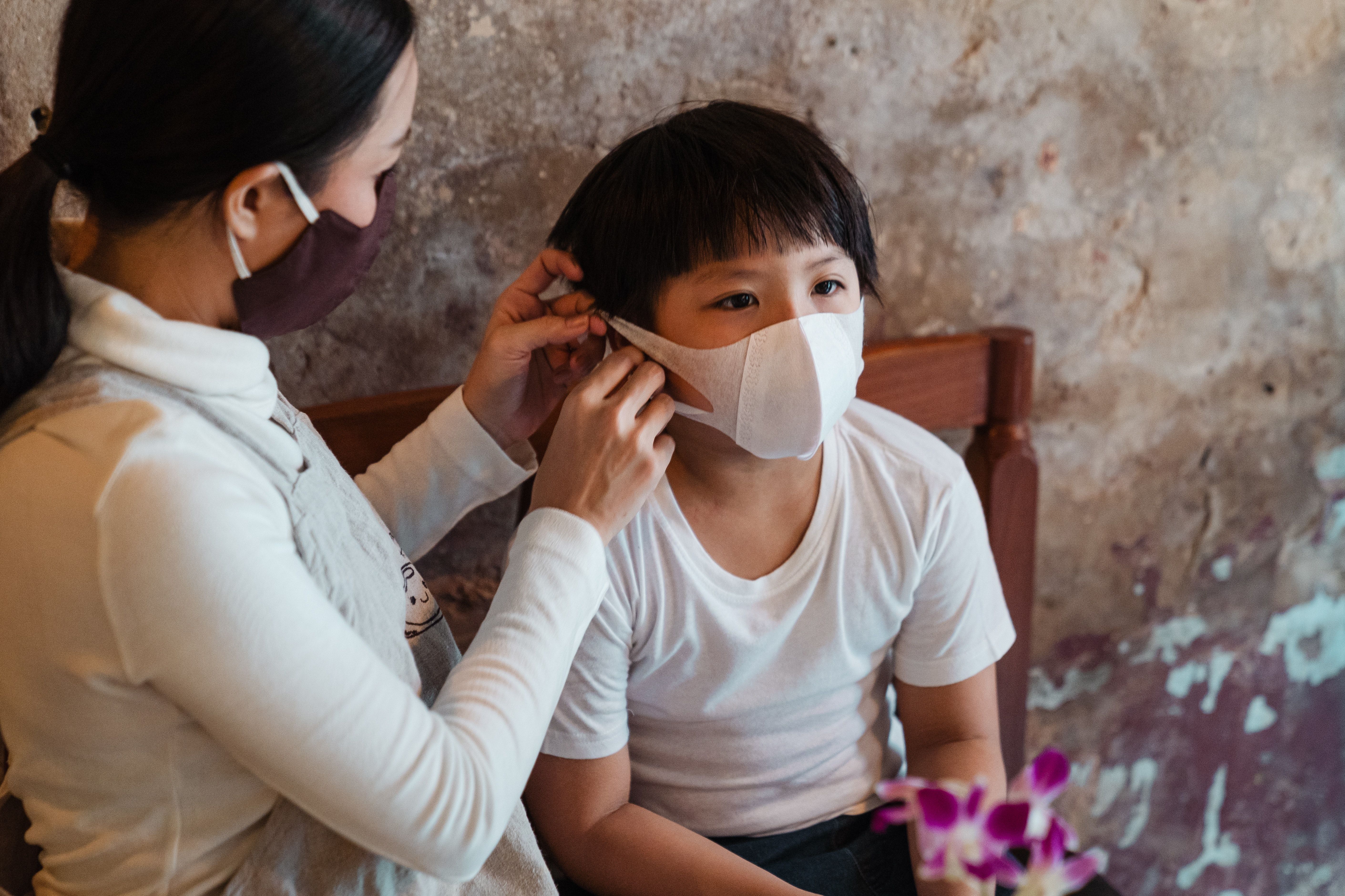 Child with mask on.