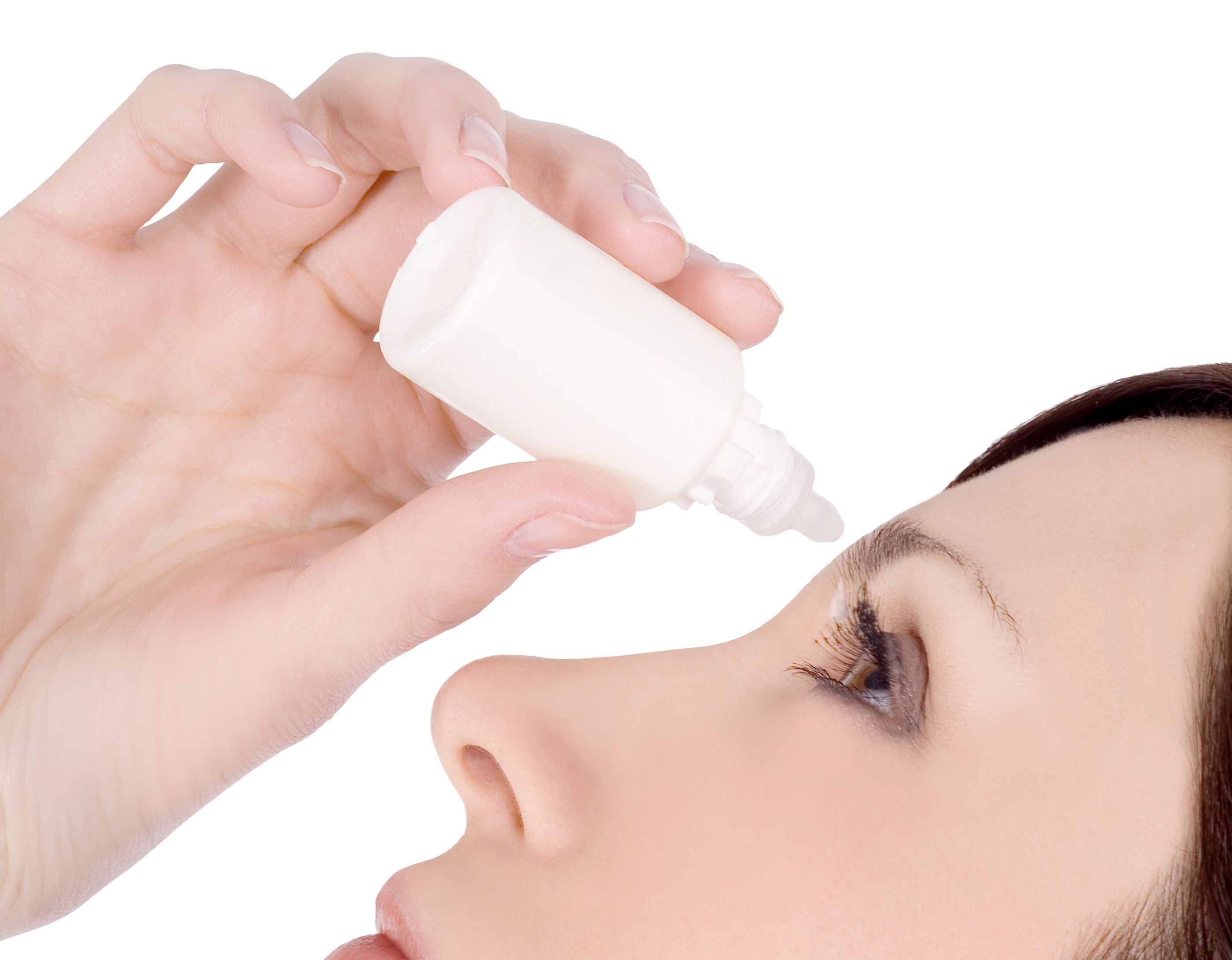 Woman using eye drops