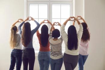 Women holding up heart hands | Image credit: Studio Romantic – stock.adobe.com