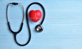 stethoscope around a heart on a blue background