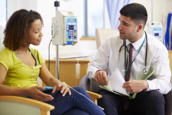 Image of Black female patient in a cancer center