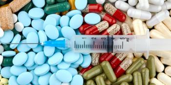 Pile of opioids and needle