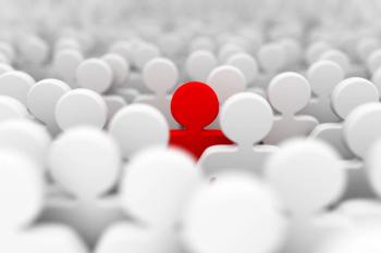 one person highlighted in a crowd