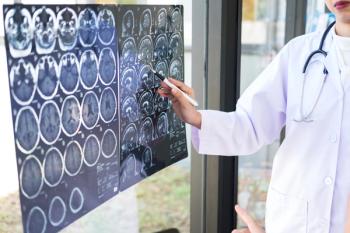 Professor Doctor discussing and consulting method with patient treatment results on brain x-ray film About the problem of the patient | Image credit: Freedomz - stock.adobe.com