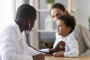 Pediatrician listening to lungs | Image credit: fizkes - stock.adobe.com