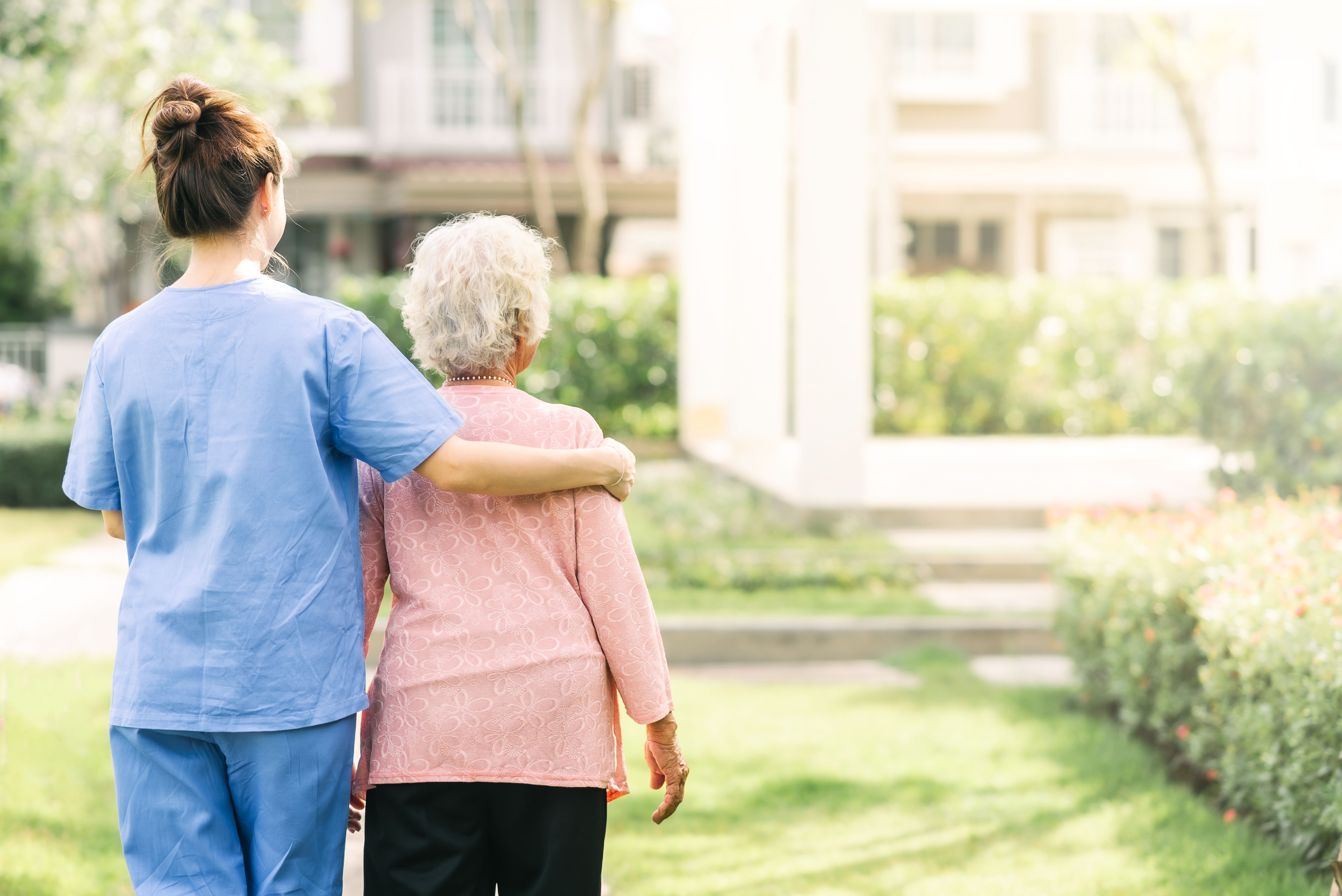 Caregiver with Patient | Image credit: interstid - stock.adobe.com