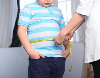 Doctor measuring overweight boy in clinic | Image credit: Africa Studio - stock.adobe.com