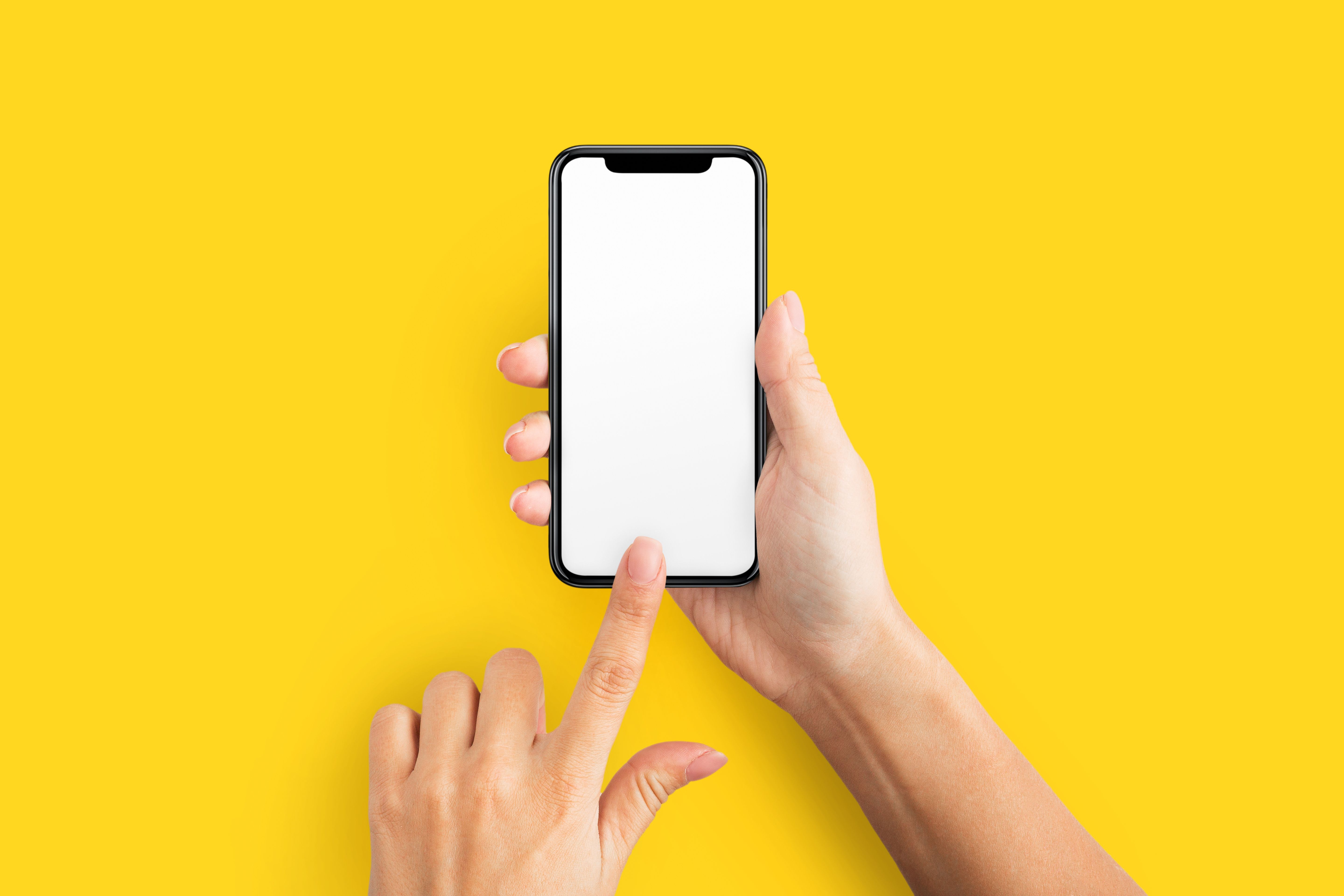 person holding cell phone with blank screen