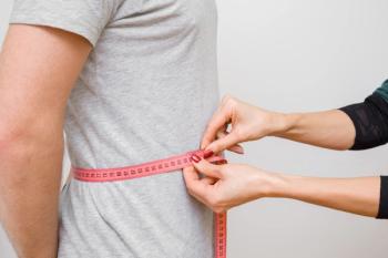 Woman measuring man's waist with tape measure | Image Credit: fotoduets - stock.adobe.com