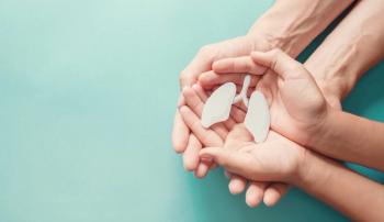 Hands holding a model of lungs | Image credit: SewcreamStudio - stock.adobe.com