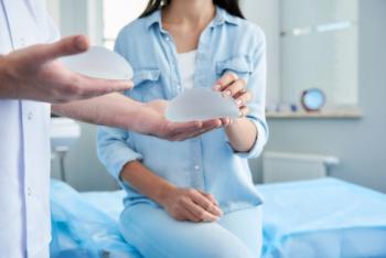 Doctor holding in his hands two silicone implants. Female patient trying to touch them: © Yakobchuk Olena - stock.adobe.com