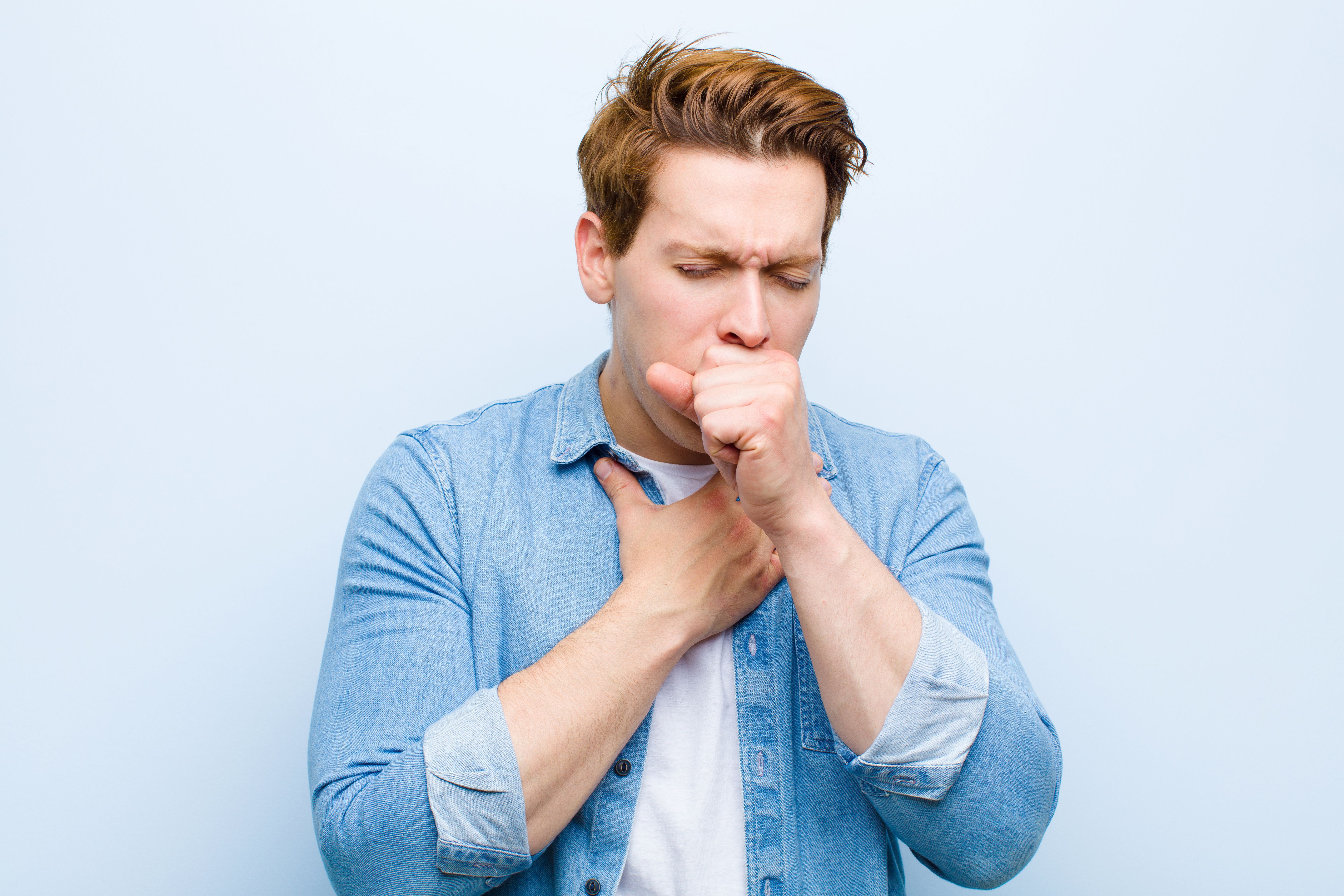 man coughing